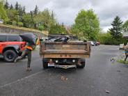 Public works team loading trash into truck